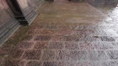 the brick corridor of a medieval fortress with arches