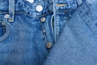 Mavi Jean Çelik Düğmesine ve Zip Kumaş Dekorasyon Arkaplanına Yaklaş