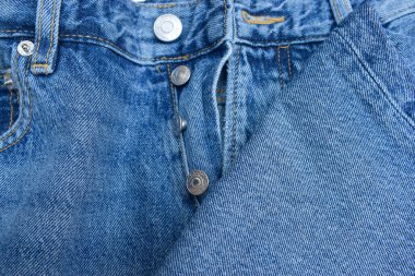 Mavi Jean Çelik Düğmesine ve Zip Kumaş Dekorasyon Arkaplanına Yaklaş