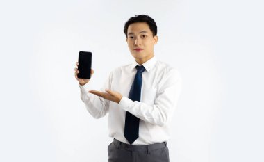 Asian working man in white shirt black tie showing smartphone black blank screen white background.	