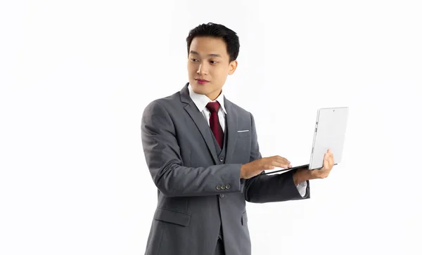 Asian Businessman Grey Suit Red Tie Standing Holding Using Laptop — Foto Stock