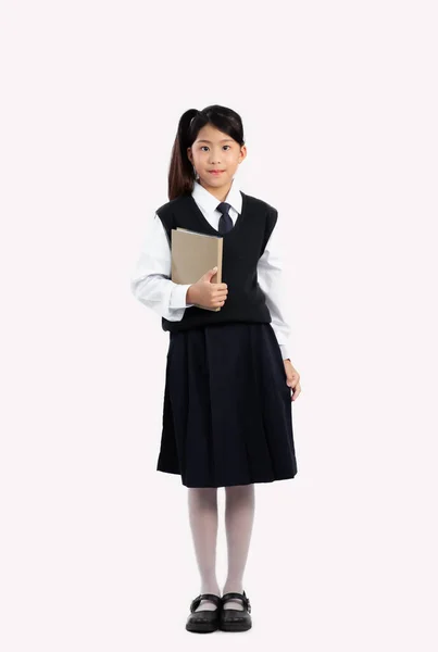 Asian Schoolgirl British International Uniform Holding Book Standing Full Length — Stock Photo, Image