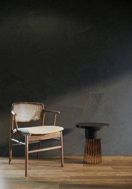 Koyu gri oturma odasındaki tek bir koltuk ve sehpa beton duvar ve ahşap zemin, dikey görüntü..