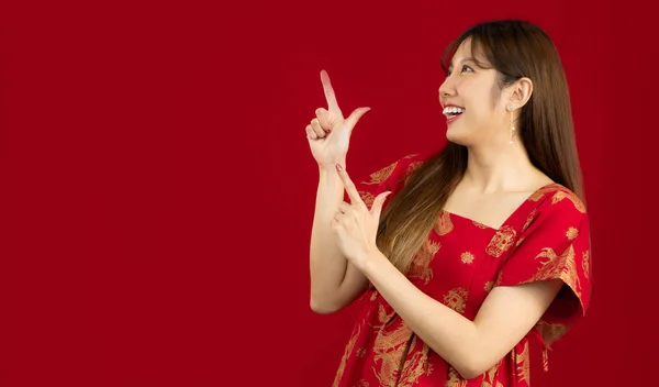 Asian Woman Red Chinese Dress Smiling Finger Pointing Your Text — Photo