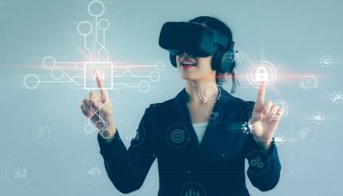 Asian businesswoman exploring virtual reality select the icon security and icon Ai on the virtual display. Business, technology, internet and networking concept.