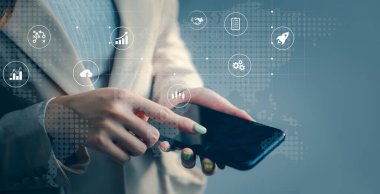 Businesswoman hands useing a smartphone connect to online data information. technology IoT, internet of things concept.	