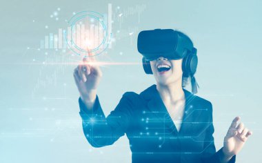 Asian businesswoman with VR headset exploring virtual reality da