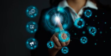 Business and technology. Businesswoman finger touching on blue icon dark background.