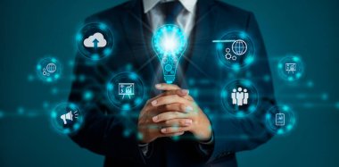 Technology concept. Blue virtual icons with businessman blurred background