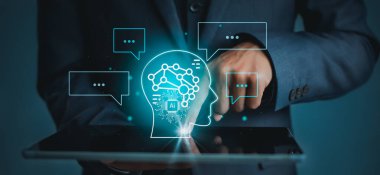 Businessman using chatbot in tablet intelligence Ai.Chat GPT Chat with AI Artificial Intelligence, developed by OpenAI generate. Futuristic technology concept.