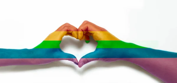 Pride rainbow lgbt gay flag overlay on hand heart LGBTQ+ Pride Month Concept background