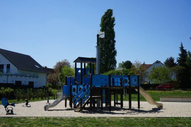 Playground in blue on a sunny May day. Berlin, Germany