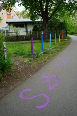 Multi-colored roadblocks symbolizing LGBT+ communities. Berlin, Germany 