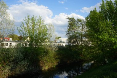 A beautiful landscape with the Wuhle River and its surrounding vegetation in May. Berlin, Germany 