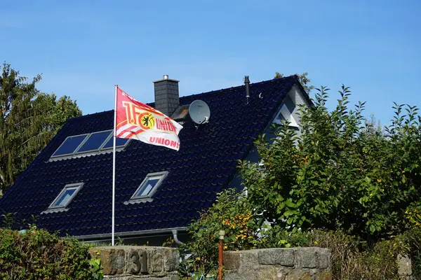 Stock image Berlin, Germany. October 7, 2022: Fan flag of the sports club Union Berlin. 1. Fuballclub Union Berlin e. V., 1. FC Union- or Union Berlin, is a professional German football club.   