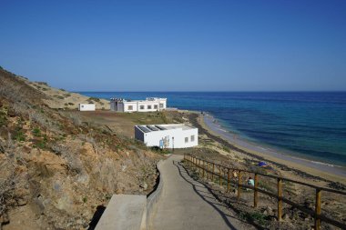 View of Esquinzo Beach, Playa de Esquinzo, on the Atlantic Ocean coast in October. Esquinzo, Fuerteventura, Las Palmas, Canary Islands, Spain.  clipart