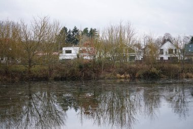 Lake Wuhlesee is partially covered with ice in February. Wuhlebecken or Wuhlesee is a lake in Marzahn-Hellersdorf, Berlin, Germany, Europe. 
