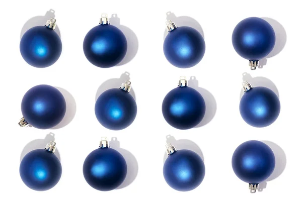 stock image Pattern of blue Christmas balls isolated on white background.