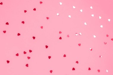 Pembe şenlikli arka plan, konfeti, doku. Seçici odak.