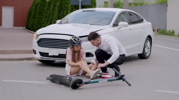 Man Hit Girl Scooter Car Driving Runs Brings Her Box — Stock Video