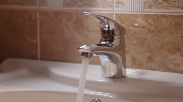 Stream Clear Water Flows Faucet Filling Porcelain Sink Home Bathroom Stock Footage