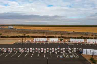 November 5, 2022, Coalinga, California. Largest Tesla Supercharger station in the world over 100 charging stalls, an expansion to the Harris Ranch Supercharger, California. clipart