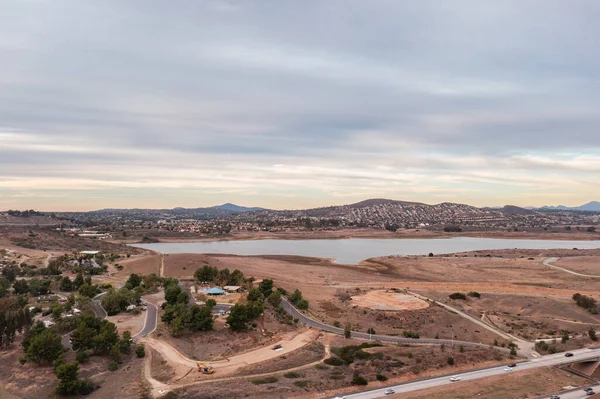 stock image Road leading to reservoir in drought-stricken San Diego. Aerial panorama. 