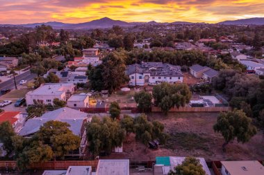 Vibrant sunrise over homes in Chula Vista, California, San Diego County.  clipart