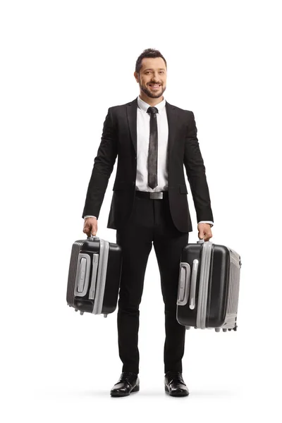 Full Length Portrait Young Businessman Carrying Two Suitcases Smiling Isolated — Stock Photo, Image