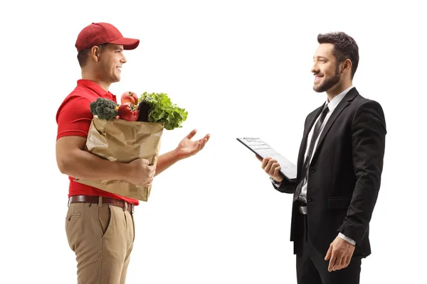 Perfil Mensajero Reparto Con Una Bolsa Comestibles Hablando Con Hombre — Foto de Stock