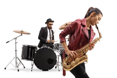 Young female playing a saxophone and a man playing drums in the back isolated on white background clipart
