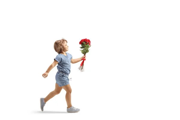 Full Length Profil Záběr Malé Holčičky Běží Červenými Růžemi Ruce — Stock fotografie