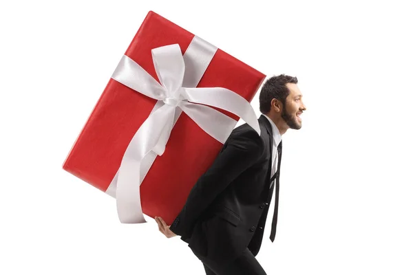 Profile Shot Businessman Carrying Big Wrapped Present His Back Isolated — Stock Photo, Image
