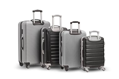 Studio shot of silver and black suitcases with wheels isolated on white background clipart