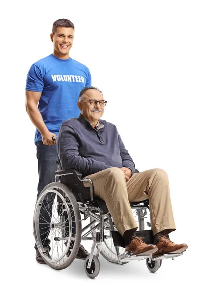 Mladý Muž Dobrovolník Stojící Zralý Muž Sedí Invalidním Vozíku Izolované — Stock fotografie