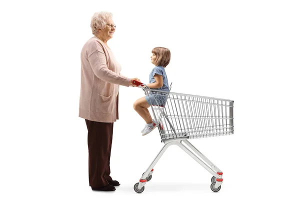 Full Length Profile Shot Grandmother Child Shopping Cart Isolated White — Stock Photo, Image