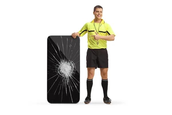Full Length Portrait Football Referee Pointing Smartphone Broken Screen Isolated — Stock Photo, Image