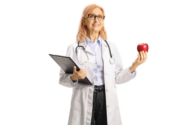 Female Doctor Holding Clipboard Red Apple Isolated White Background — Stock Photo, Image