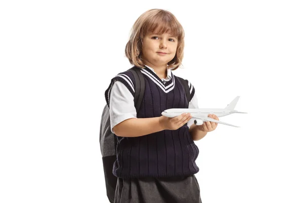 Menina Uniforme Escolar Segurando Avião Isolado Fundo Branco — Fotografia de Stock