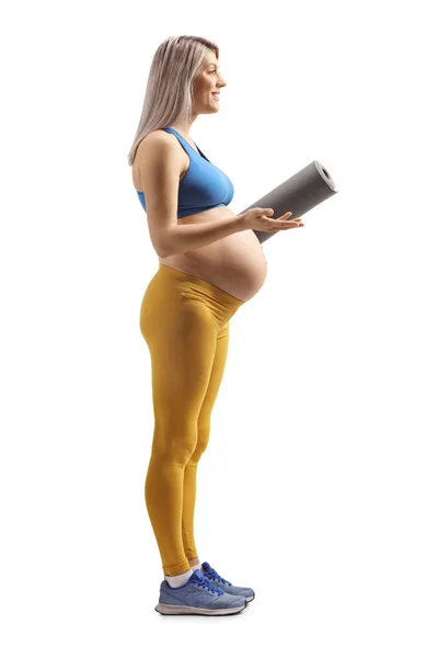 Foto Perfil Completo Una Mujer Embarazada Ropa Deportiva Sosteniendo Una —  Fotos de Stock