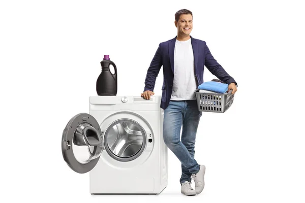 Young Man Leaning Washing Machine Holding Basket Clothes Isolated White — Stock Photo, Image