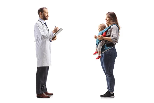 Full Length Profile Shot Male Doctor Talking Mother Baby Isolated — Stock Photo, Image