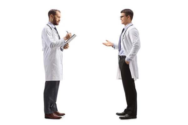 Doctor Talking Colleague Standing Writing Document Isolated White Background — Stock Photo, Image