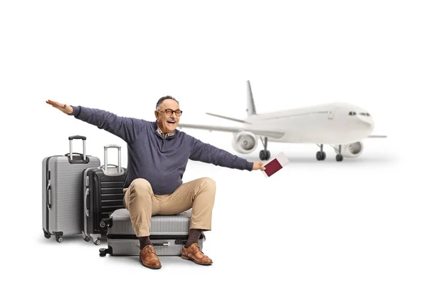 Mature Man Sitting Suitcase Passport Ticket Spreading Arms Fly Isolated — Stock Photo, Image