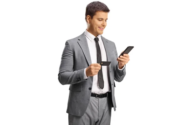 Uomo Sorridente Professionista Utilizzando Uno Smartphone Una Carta Credito Isolata — Foto Stock