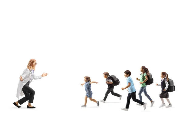 Group of children running towards a female doctor isolated on white background