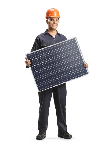 stock image Worker in a uniform holding a solar panel isolated on white background