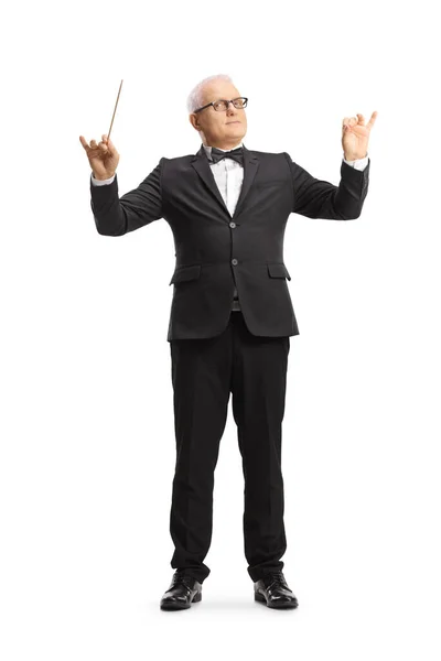 Full length portrait of a music conductor directing a performance isolated on white background