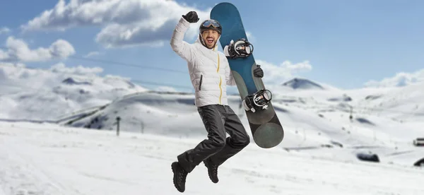 Happy Man Snowboard Jumping Gesturing Happiness Snowy Mountain — Fotografia de Stock