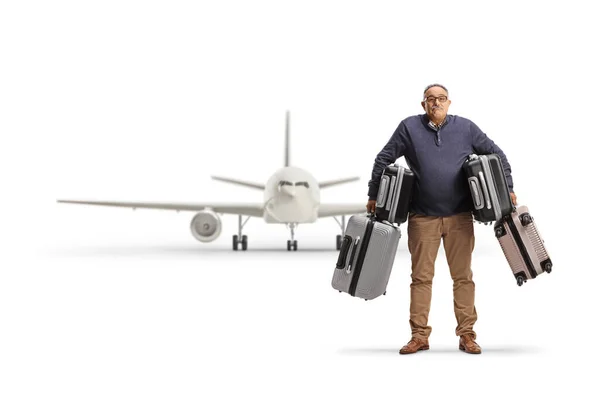 Confused Mature Man Carrying Heavy Suitcases Front Airplane Isolated White — Stock Photo, Image
